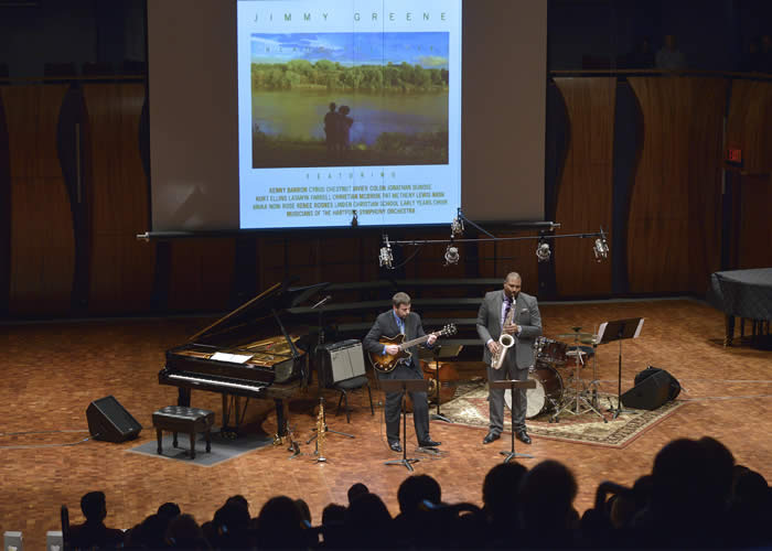 (l-r): Image of Jamie Begian and Jimmy Greene performing