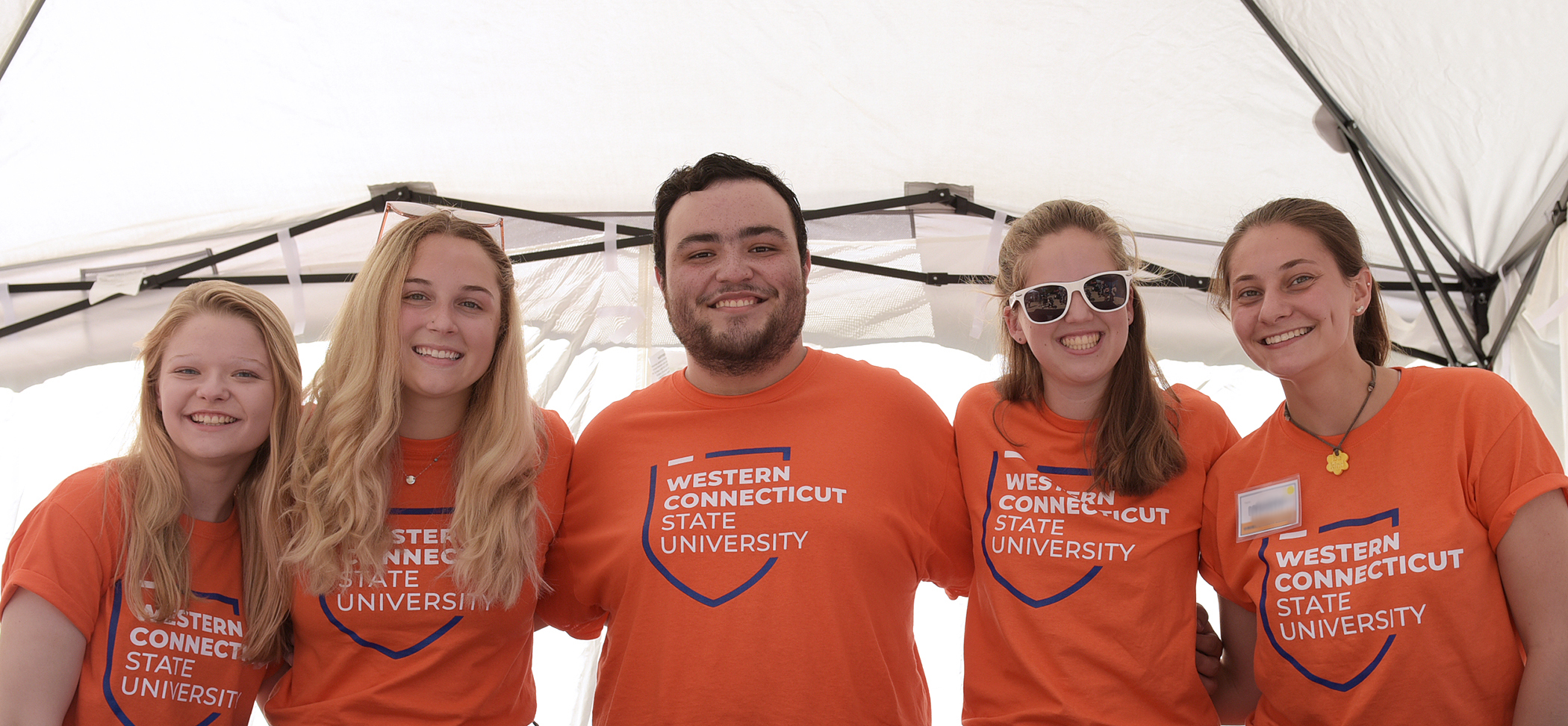 Welcome week students with WCSU shirts