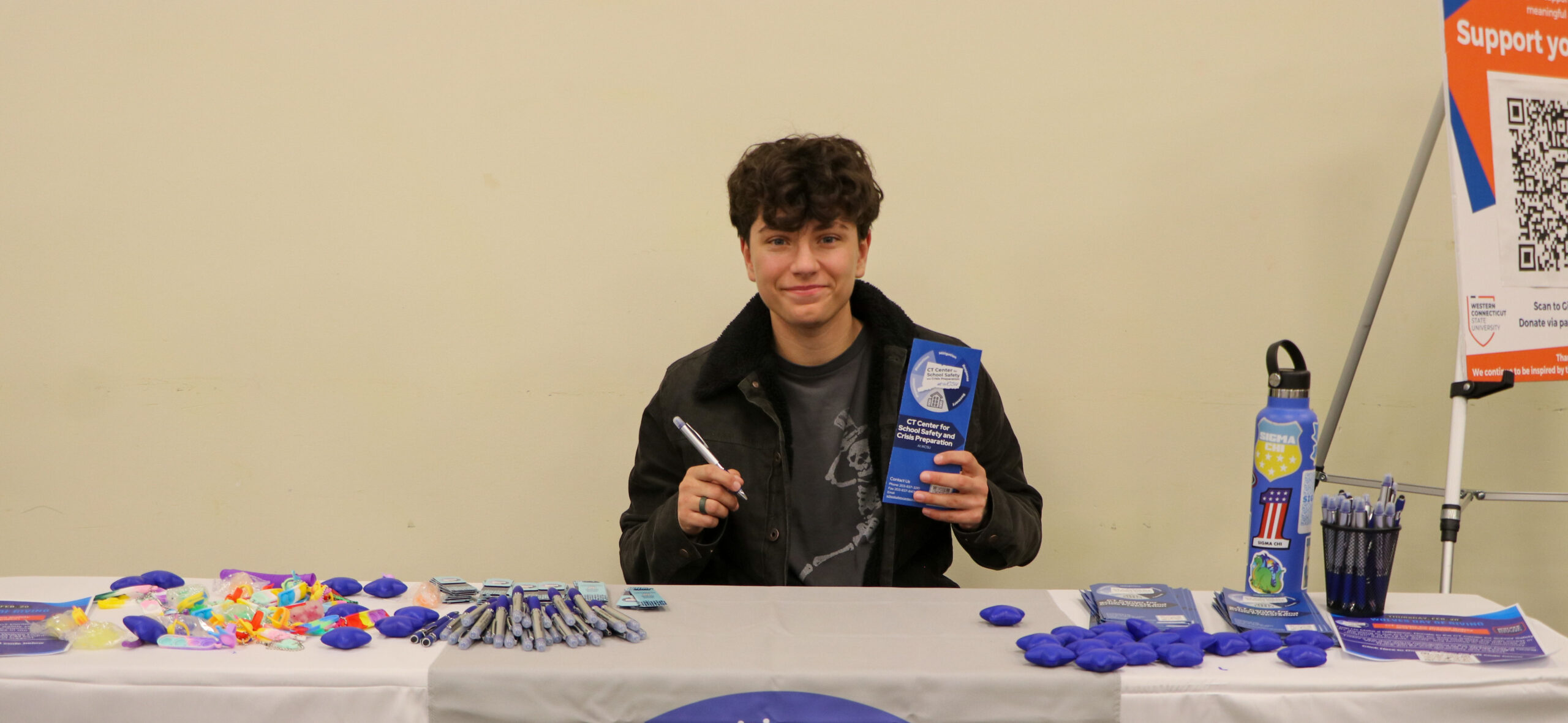 Representative of the Safety Center sitting a table