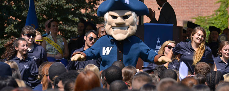 WCSU's mascot, "The Colonial", welcomes new students along with the WCSU Student Welcome team.