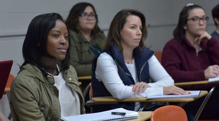 Students from the education program learning in a classroom