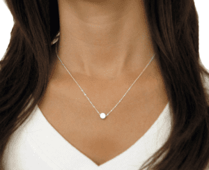 Photo of a woman wearing a necklace.