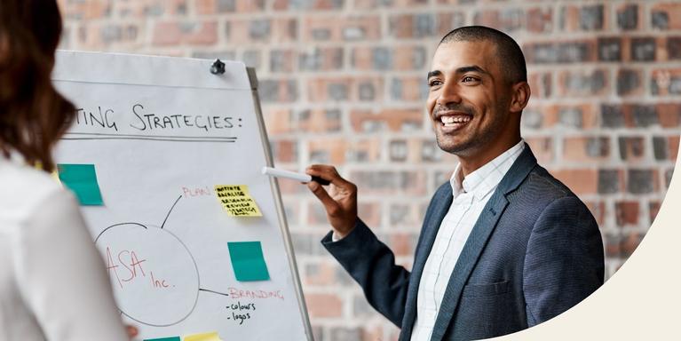 man smiling during presentation