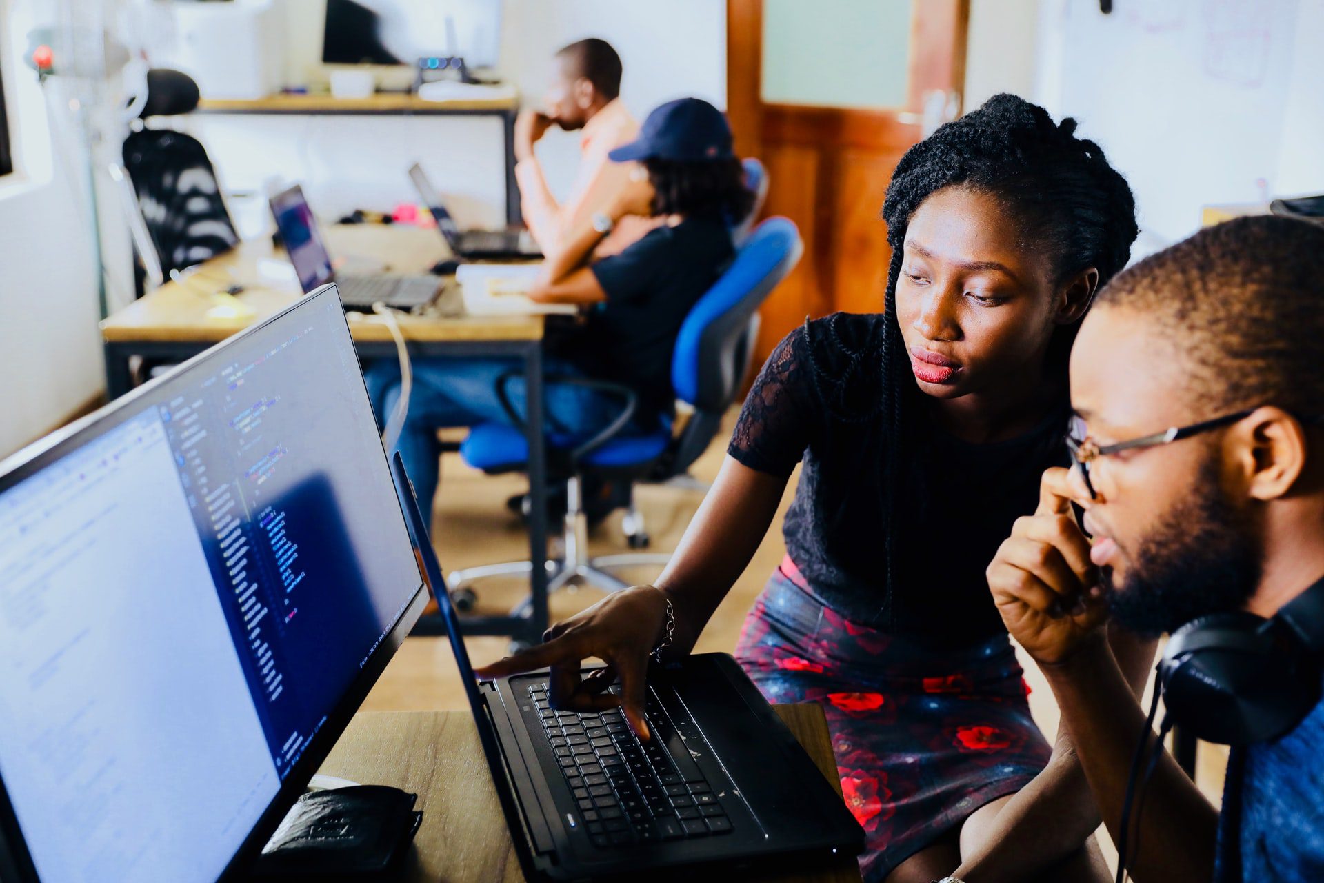 Two people looking at a computer screen