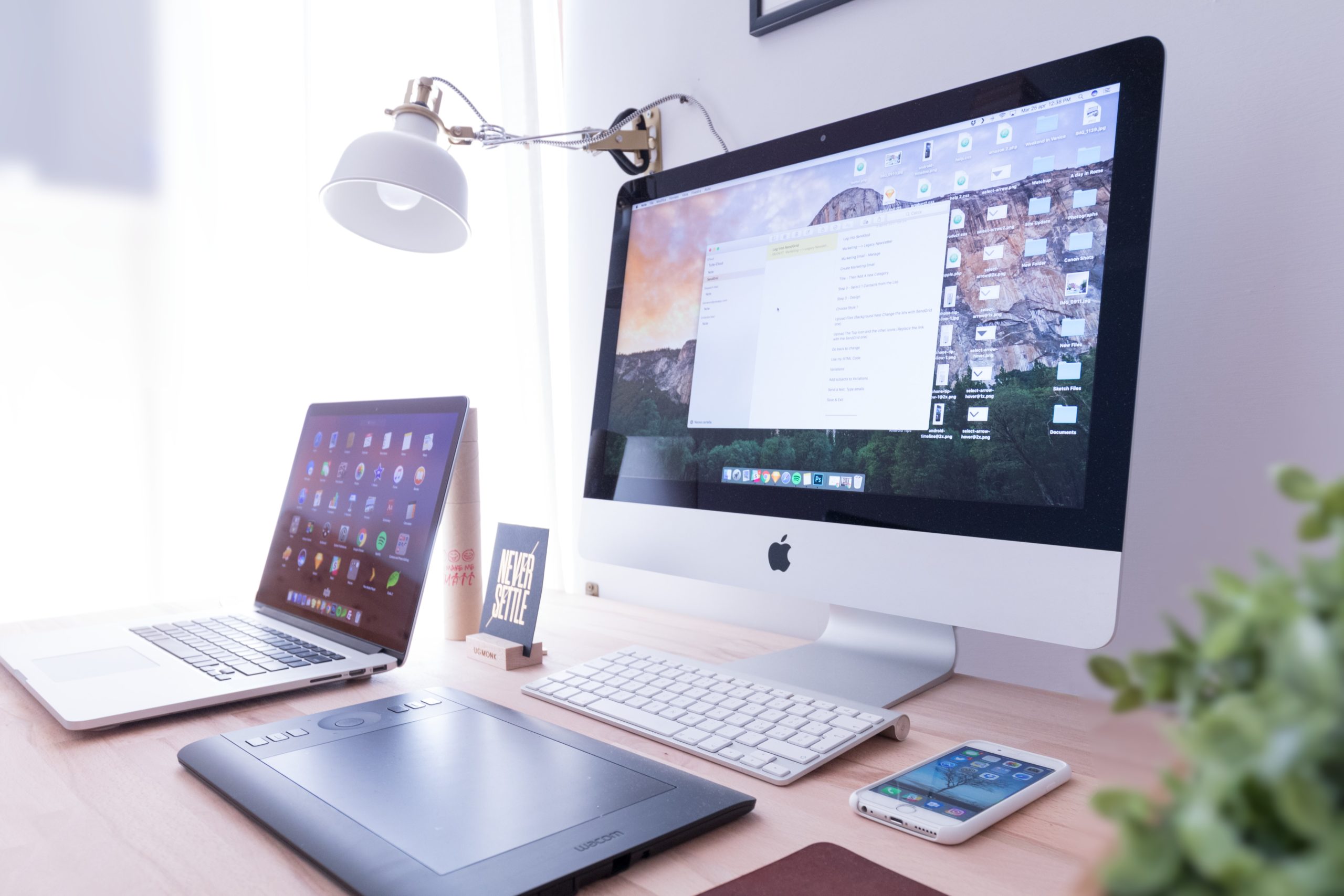 Photo of a Desktop and Laptop work setup