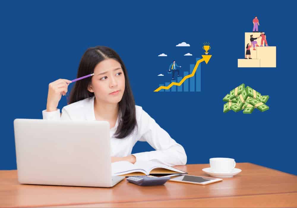 Person pondering what they value from a job, as they sit at their desk with laptop open