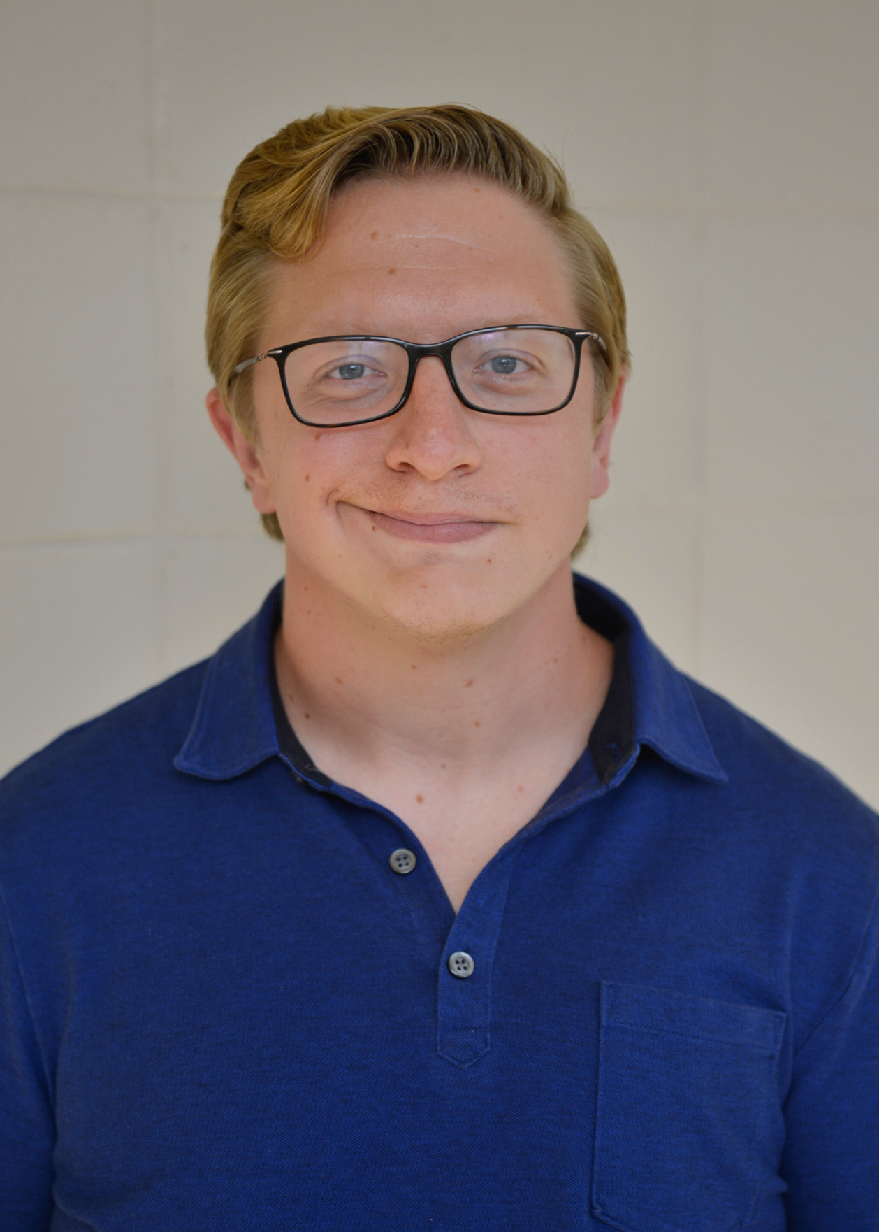 Headshot of Dr. Adam Brewer