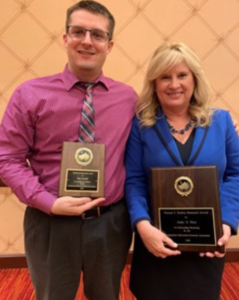 Dr. Piro and Dr. Gundel holding their 2019 NERA awards