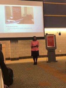 Dr. Theresa Canada standing in the front of the room at her book signing in 2019