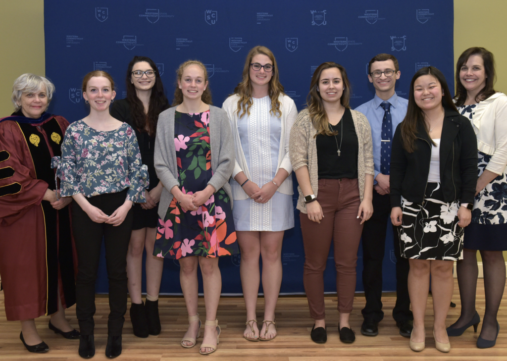 Photo of seven of the Convocation Awardees standing with Dr. Mead and Dr. O'Callaghan