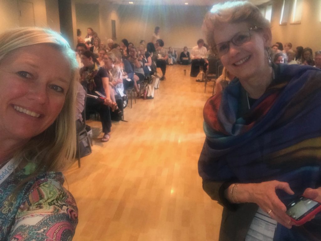 Dr. Marcia Delcourt standing in a room of people attending the conference for the World Council for Gifted and Talented Children in Nashville, July, 2019.