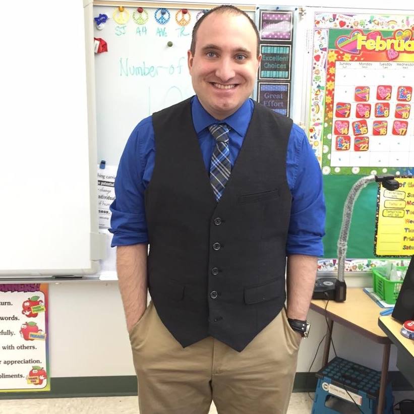 Matthew Calvanese, Elementary Education alumnus, standing in a classroom.