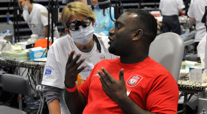 A doctor takes a closer look at a man