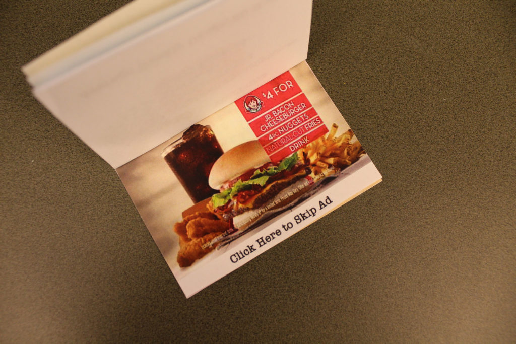 A screenshot of a Wendy's ad for a $4 deal. A Jr. bacon cheeseburger is in front with four chicken nuggets and fries on either side and a soda in the back. The bottom of the page says, "Click Here to Skip Ad."