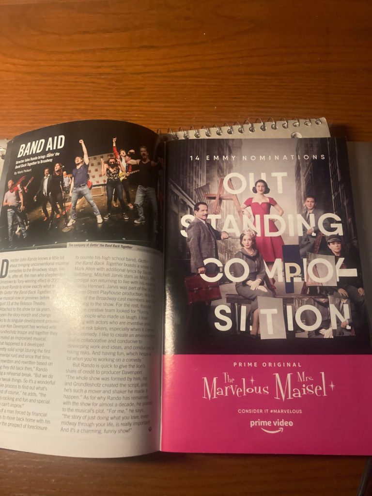 Collage inside The Band's Visit Playbill. Text surrounding actors originally said, "Outstanding Comedy Series." Text from the same page in a different Playbill has been cut out and pasted over letters to make the text read, "Outstanding Composition."