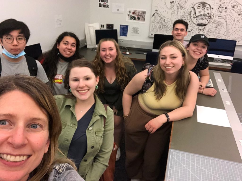 The instructor and students take a picture together.