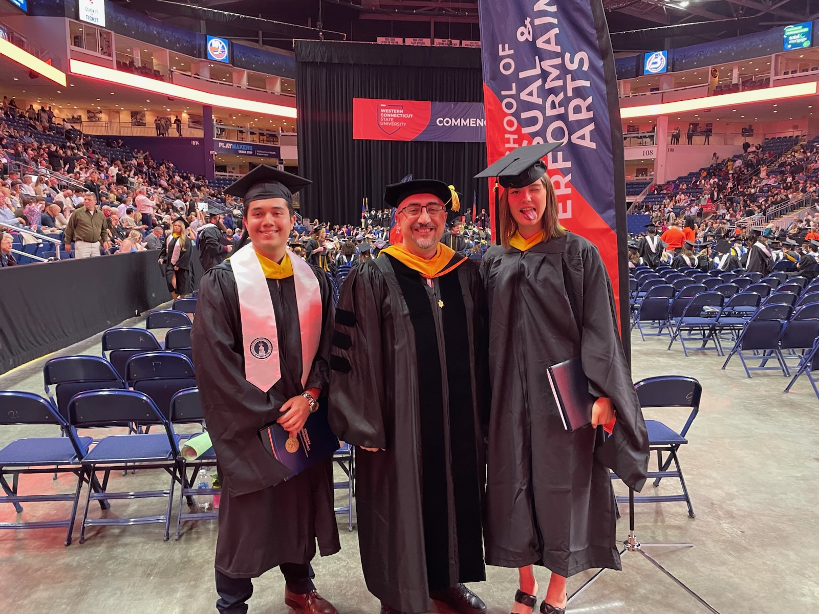 Students Nicholas W. Ambrosio and Meaghan Geraghty, with the program coordinator, Dr. Arslan, during the 2024 commencement