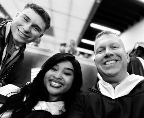 Students Michael Azzi, Eric Scorca, and Elihle Sangweni during the 2026 commencement