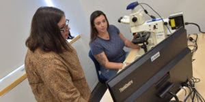(l-r): Assistant Professor of Biology Dr. Kristin Giamanco and recent graduate Krisa FitzGerald in the Microscopy Lab.