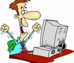 Man cheering at computer