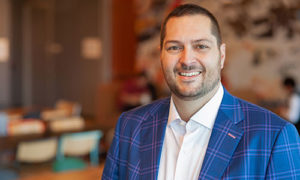 How a WCSU alumnus ended up leading Google’s Cloud Security sales team: ‘Differentiate Yourself’ and build a life beyond your dreams Jeff DiStasio Jeff DiStasio As a high school student in the mid-1990s, Jeff DiStasio looked at colleges with an eye toward biology/pre-med, and a future career in medicine. Since he would be paying part of his way through school, he chose to attend Western Connecticut State University, took some small student loans and sought an on-campus student job to keep his costs down. That work-study job ultimately led to a change of his major, a complete 360 in his future career and a positive return on investment. Speaking from his home during a break from crisscrossing the country for his job as director of Cloud security sales for Google Cloud, DiStasio reminisced about his time at WCSU. “As I was working my student job checking people in at the Westside Computer Lab, I thought, ‘I know a little about computers; I could do a lot more than this,’ DiStasio said. So, when WCSU’s IT Director at the time walked into the lab, he asked if there were any more challenging opportunities. Soon, DiStasio was assisting the university’s network manager — first as a student worker and then as a university assistant — gaining hands-on experience designing the ethernet network for a new residence hall on campus. The knowledge and hands-on exposure to networking that he gained led DiStasio to switch his major from pre-med to MIS-Cybersecurity. “Professor of Management Information Systems Dr. Marie Wright started WCSU’s program in Information Security Management,” DiStasio said. “She pioneered it when cybersecurity had just started to come into the conversation, and brought in guest lecturers like Mike Jacobs, the deputy director of Information Systems Security for the National Security Agency.” DiStasio’s future was about to change course thanks to his new passion: cybersecurity. Upon graduating in 2000, he got his first job at NASDAQ as a network engineer. “Those years of hands-on, real-world experience that I acquired as a student worker at WCSU were a huge springboard,” DiStasio explained. “It helped me differentiate myself.” From NASDAQ, DiStasio did a stint in network engineering at hedge fund Andor Capital Management before going to Extreme Networks as a pre-sales engineer — coupling his technology background with a sales focus. It’s often difficult to bridge the divide between technology and business in going from pre-sales engineering to sales, DiStasio said, but it enabled him to set himself apart as someone with both skill sets, and he became a successful salesperson at Extreme Networks, even luring business away from Cisco. This caught Cisco’s attention, and DiStasio ended up as a sales account manager with Cisco for more than 14 years, climbing the ranks while managing larger accounts, and leading larger teams and organizations. DiStasio had moved to a leadership role at Salesforce when the opportunity with Google arose. “Google had an early stage project, and they needed am Americas sales leader,” DiStasio explained. “The responsibility was to build out a new Google endeavor aimed at providing cloud security solutions to the enterprise market for Google Cloud.” In the year+ since taking on his director role at Google, DiStasio has tripled the size of his team and is planning for “hypergrowth” as they provide Cloud security services for the market under the Google Cloud umbrella. DiStasio started at Google in the middle of the pandemic. Despite that, he has spent a lot of time on the road meeting his sales team and connecting with potential customers. “Google builds such an incredible experiential place to be that employees want to go to work and not work from home,” DiStasio said. “I also learned about myself during the pandemic that I thrive on being with people and not working remotely behind a video screen.” The personal connection to people is a large part of the memories he holds about his time at WCSU, and how those interactions contributed to the life he lives now. “I feel like the university was a more intimate setting, where you could get to know your fellow students and professors better,” DiStasio recalled. “Many of my closest, lifelong friends I met at WCSU, either through Tau Kappa Epsilon, the Newman Center or my work at campus IT. I met my wife of 21 years, Laurie, who was a Nursing student a few years ahead of me. I stay in touch with several of my professors, and I don’t think I would have made these kinds of connections at a larger school elsewhere. At WCSU, it was easier to not get lost in the crowd and find your niche of people.” In addition to his friendships and connections, his employment path was also greatly affected by his decision to come to WCSU. “The biggest thing I always go back to in my career is to differentiate yourself as early as you can,” DiStasio said. “Take any opportunity you’re given and do something with it. WCSU gave me the opportunity because it was a smaller, more accessible school.” As for DiStasio’s prior dream of a career in medicine? That has continued, too — just in a slightly different way. He and his wife currently are volunteer EMTs in their hometown. Asked what advice he would give a current high school student considering where to pursue their higher education, DiStasio said, “College is not just an opportunity to educate yourself, it’s an opportunity to acquire experiences and differentiate yourself. Since I partially paid for my education myself, the value I got back was very important to me — and this path I took at WCSU has worked out pretty well.”