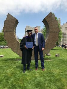 Professor of Justice & Law Administration Terry Dwyer with Raneil Smith after his UConn Law School commencement.