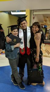 Logan, Brian and Victoria Ferreira at Brian's MFA in Illustration Commencement ceremony in 2019
