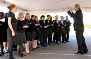 Dr. Kevin Jay Isaacs conducts the Chamber Singers at the Visual and Performing Arts Center groundbreaking ceremony in 2012