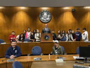 Rogers Park Middle School's 6th-grade social studies class visits Mayor Roberto Alves at Danbury City Hall, accompanied by teachers Brian Betesh and Emily Lopes.