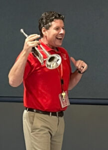 Monroe 2025-26 Teacher of the Year Michael Ances with his instrument of choice, the trumpet.
