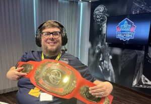 John Laub with a CFF Kings Classic College Fantasy Football belt.