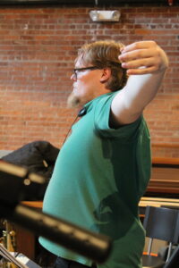 Dan O'Brien conducts a large ensemble.
