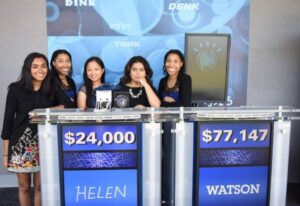 First-place winners of the IBM Research BlueHack at the Thomas J. Watson Research Center. Nikita S. Karim (second from right) and her teammates stand with their TJBot in front of the iconic IBM Watson Jeopardy!