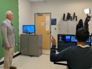 As producer, Cameron Kurasz gives Neal Macmillen his cue.