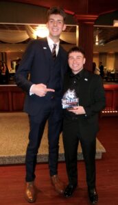 2026 SGA President Owen Ibey presents his predecessor Michael Azzi with the 2026 SGA President's Award.