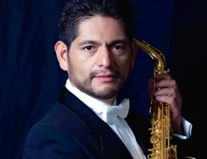Javier Oviedo holding Saxophone