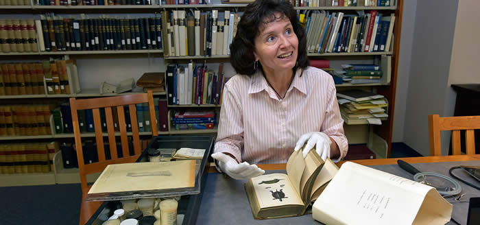 Professor of Biological and Environmental Sciences Dr. Dora Pinou with the H.G. Dowling Herpetological Collection