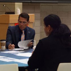 President Bernal and Melissa Stephens at work in professional attire