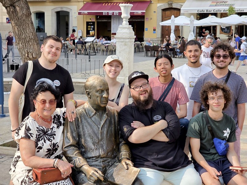 Galina with Students on a bench in Spain