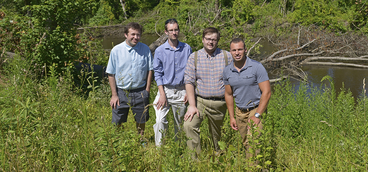 Photo of meteorology students near a creek